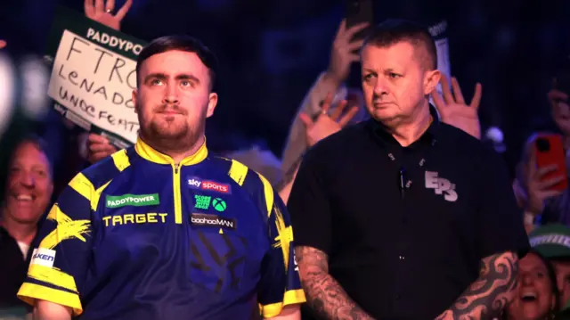 Luke Littler prepares to walk on stage
