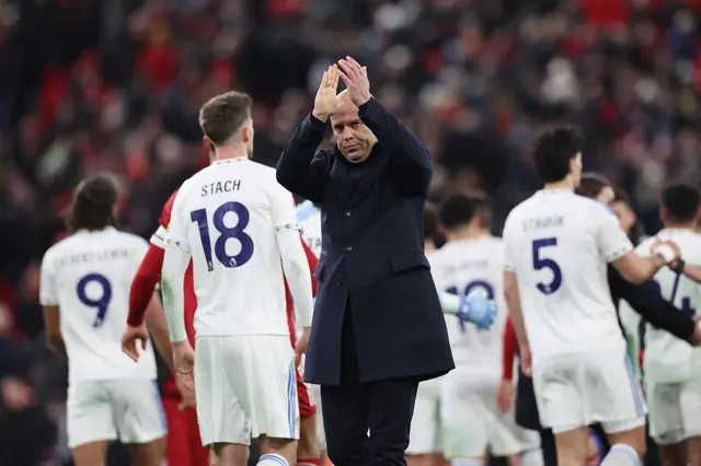 Liverpool's Dutch manager Arne Slot applauds the fans at the end of the English Premier League football matc