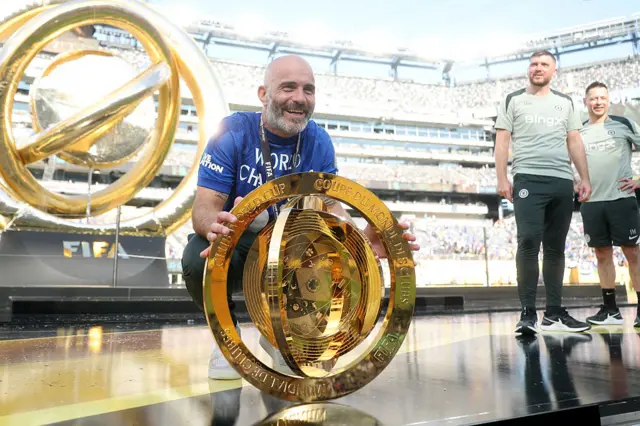 Enzo Maresca poses with the Club World Cup trophy