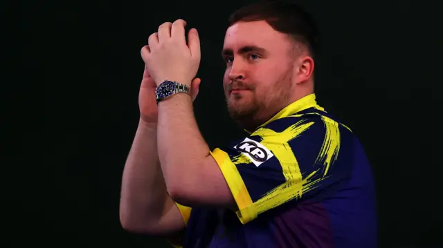 Luke Littler applauds