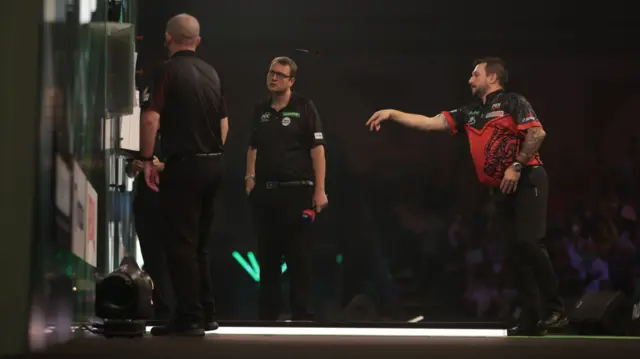 Jonny Clayton throws a dart