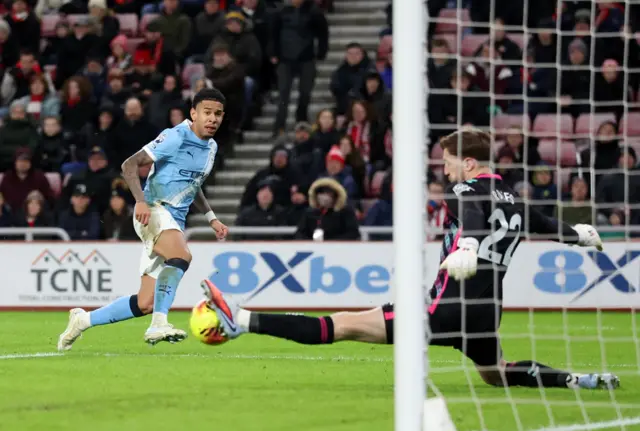 Sunderland's Robin Roefs in action as he makes a save from Manchester City's Savinho