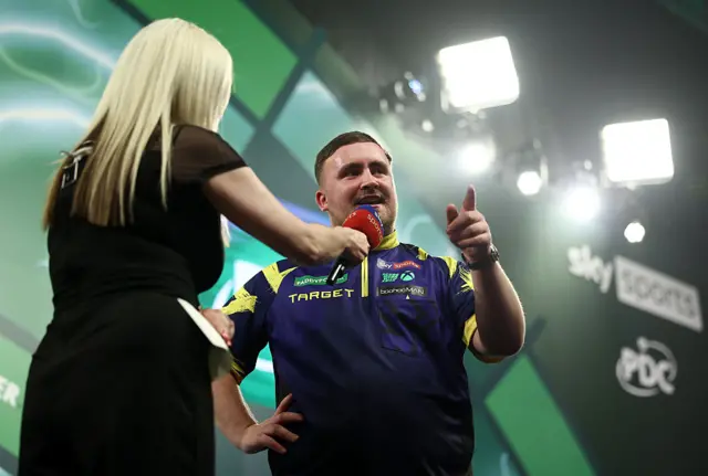 Luke Littler being interviewed by Sky Sports on the stage