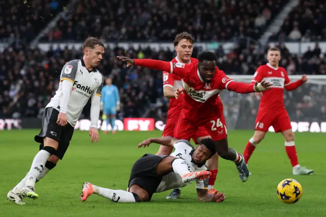 Rhian Brewster of Derby County is tackled by Alex Bangura of Middlesbrough