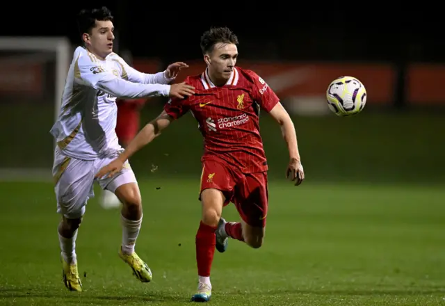 James Norris holds off Enes Osmani and chases after the ball