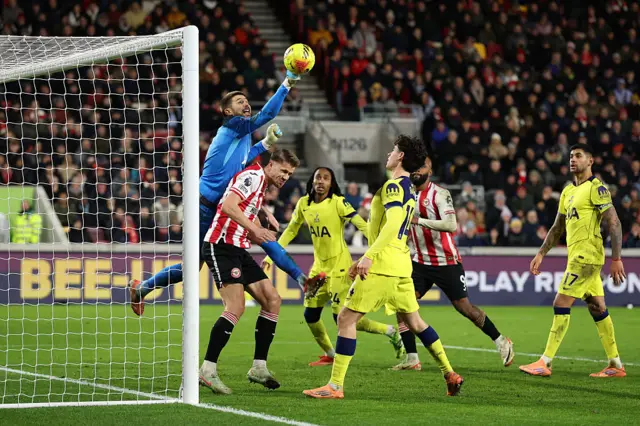 Guglielmo Vicario of Tottenham Hotspur punches a crossed ball