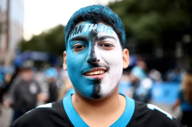 A Panthers fan with face paint