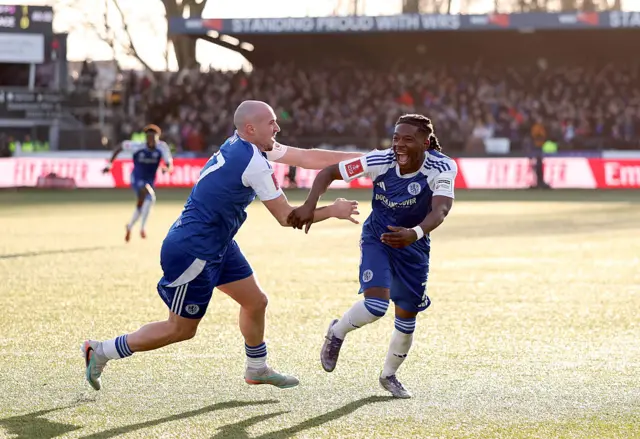 Isaac Buckley-Ricketts of Macclesfield celebrates scoring his team's second goal with teammate Josh Kay