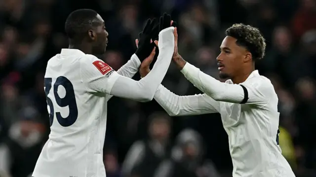 Randal Kolo Muani high-fives Wilson Odobert