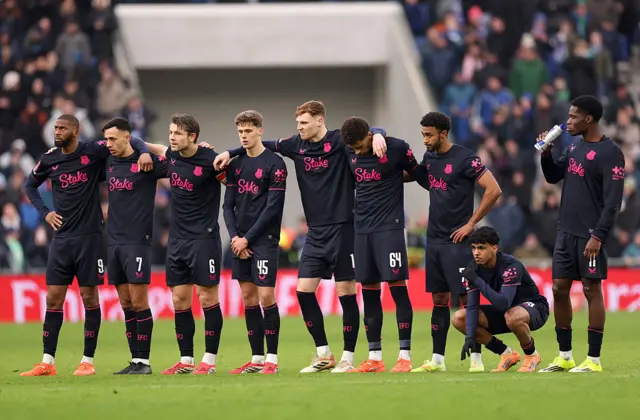 Everton players look on during penalties
