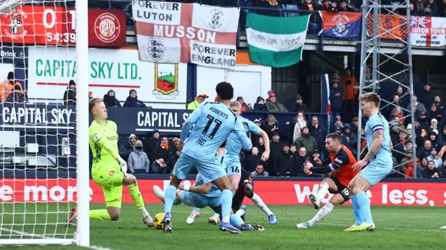 Jordan Clark scoring Luton's equaliser against Stevenage