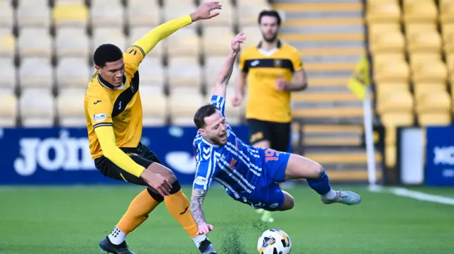 Livingston's Brooklyn Kabongolo fouls Kilmarnock's Bruce Anderson