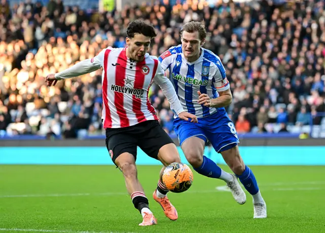 Aaron Hickey is put under pressure by Svante Ingelsson