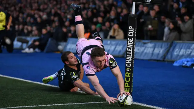 Tom Bowen dives for the score