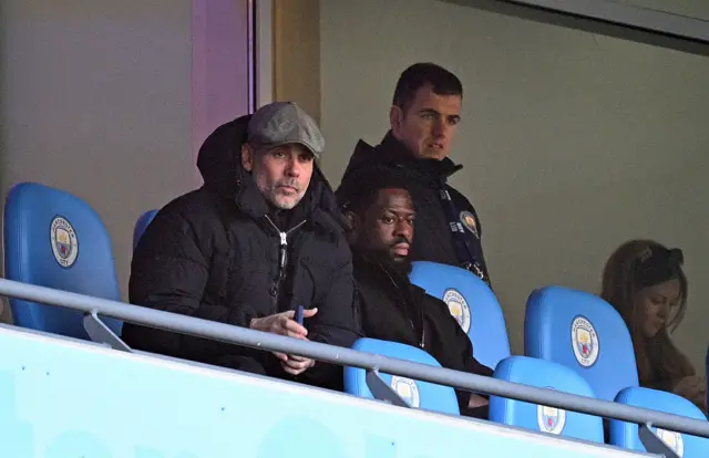 Pep Guardiola watching from the stands
