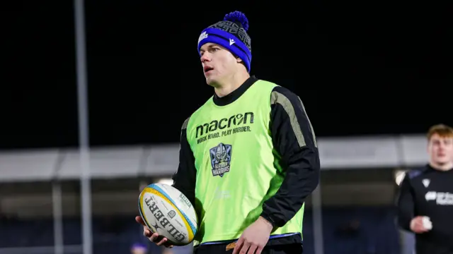 Huw Jones warming up for Glasgow