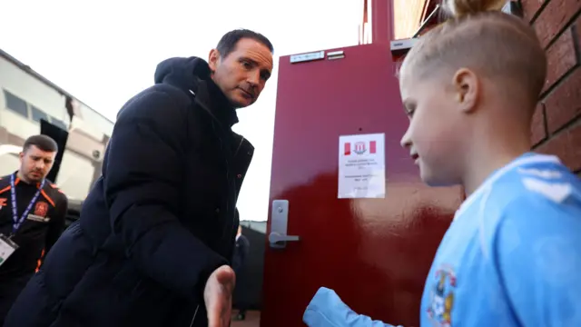 Frank Lampard greets a young Sky Blues arrives at the Bet365 Stadium for the FA Cup tie between Stoke and Coventry