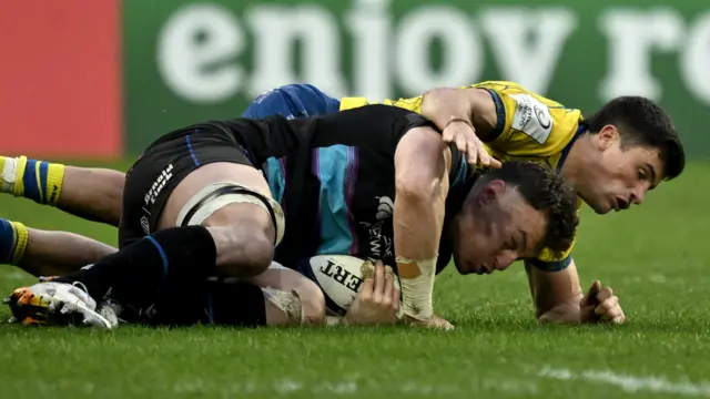 Jack Dempsey is tackled
