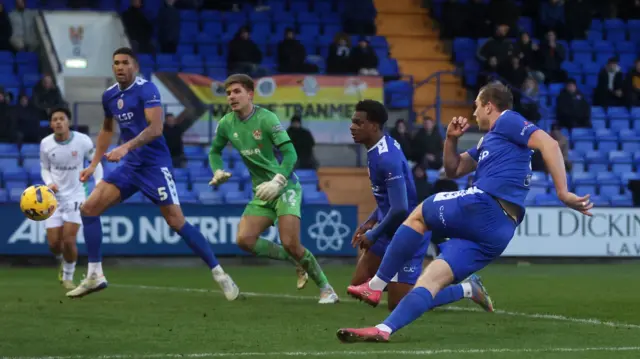 Bromley's Michael Cheek scores his and his side's second goal at Tranmere