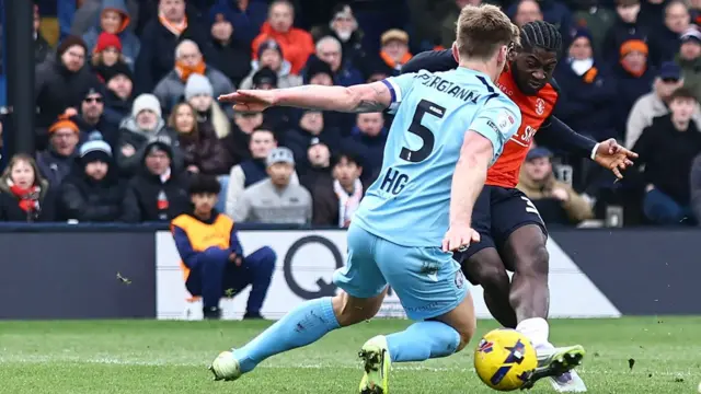 Gideon Kodua guiding home the winning goal for Luton against Stevenage