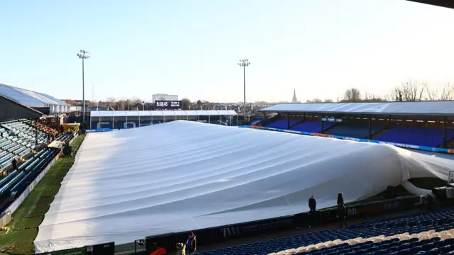A general view of Stockport's ground with pitch covers on due to the freezing temperatures brought by Storm Goretti