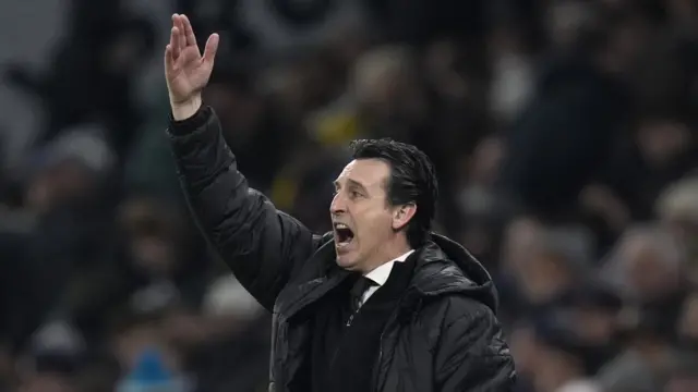 Una Emery with hand raised