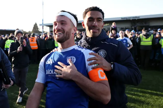 Paul Dawson celebrates on the pitch