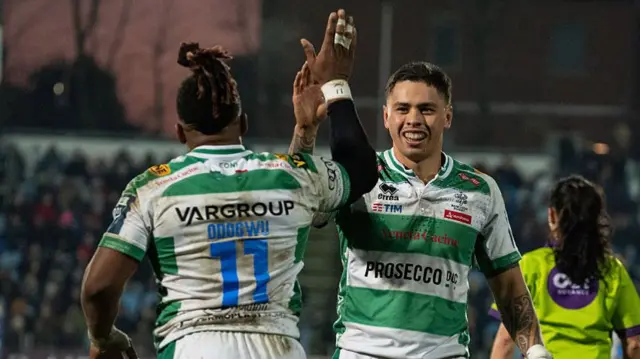 Benetton players Odogwu and Umaga high five
