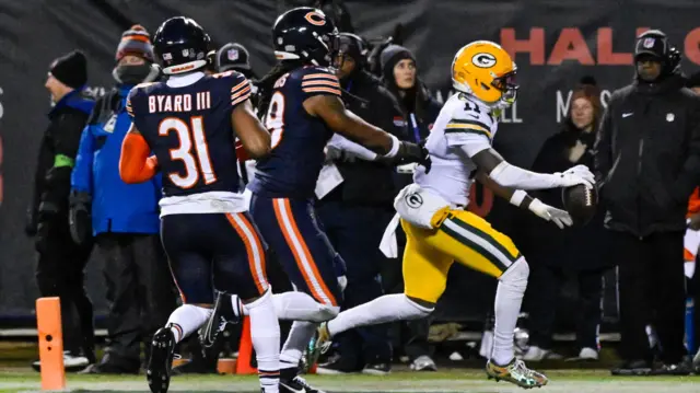 Green Bay Packers wide receiver Jayden Reed scores a touchdown against the Chicago Bears