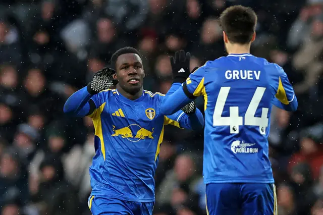Wilfried Gnonto (L) celebrates with Leeds United's Bulgarian midfielder #44 Ilia Gruev