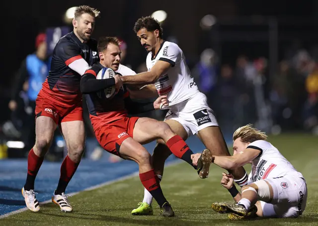 Saracens' South African scrum-half Ivan van Zyl is tackled by Toulouse centre Paul Costes