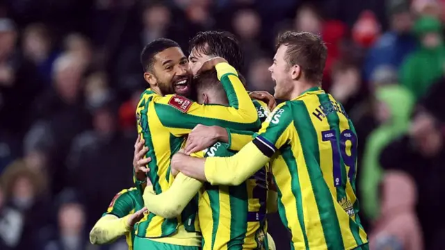 Ollie Bostock celebrates with his teammates
