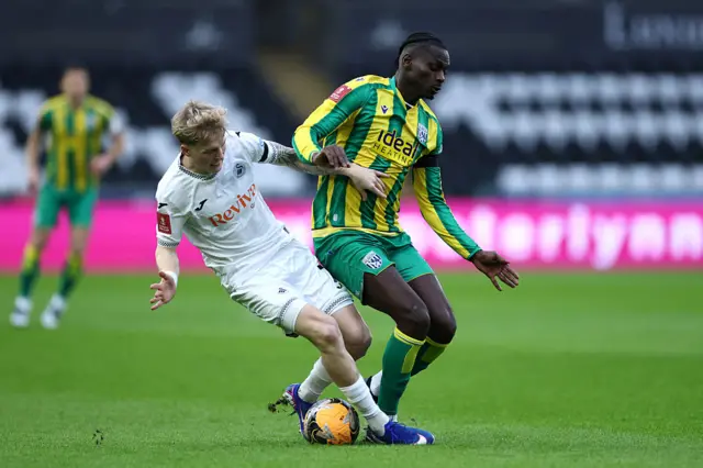 Ousmane Diakite and Melker Widell battle for possession