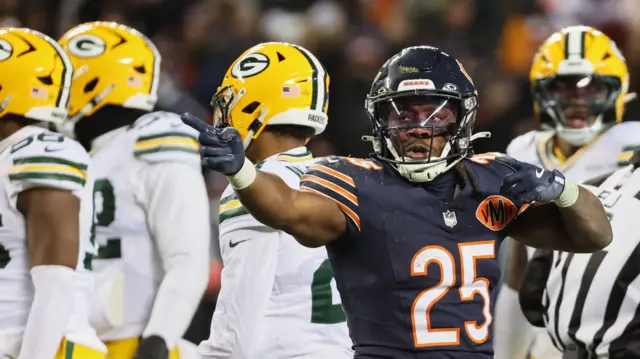 Chicago Bears running back Kyle Monangai gestures toward the Green Bay Packers end zone