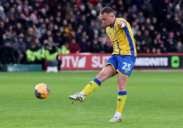 Louis Reed strikes the ball