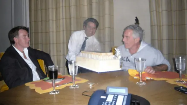 Undated handout photo issued by the US Department of Justice of Lord Mandelson (left) and paedophile financier Jeffrey Epstein (right) and a birthday cake, released in the latest tranche of Epstein files