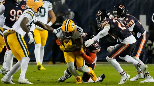 Josh Jacobs runs the ball for the Green Bay Packers against the Chicago Bears