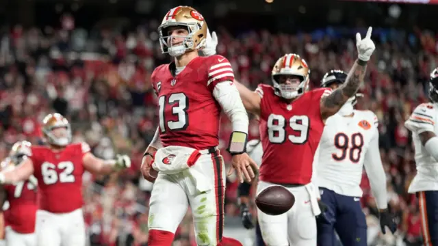 San Francisco 49ers quarterback Brock Purdy celebrates after scoring a touchdown against the Chicago Bears