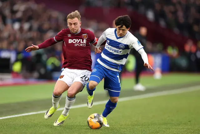 Koki Saito holds off the challenge of Jarrod Bowen