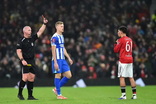 The referee shows Shea Lacey a red card