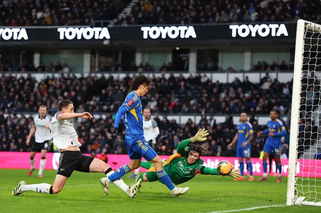 Ao Tanaka scoring a goal