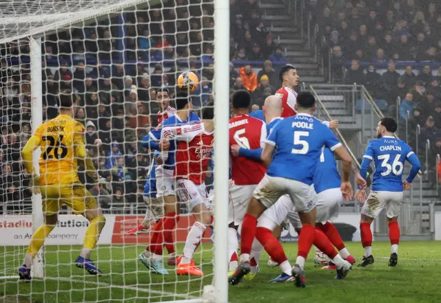 Gabriel Martinelli heads the ball through a crowded box