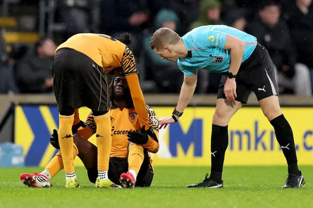 Darko Gyabi on the floor with an injury