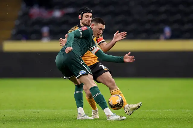 Lewis Miller and Lewie Coyle battle for possession