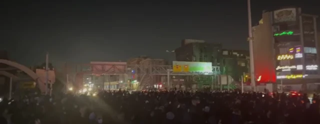 Protesters gather in Punak Square, Tehran, at night