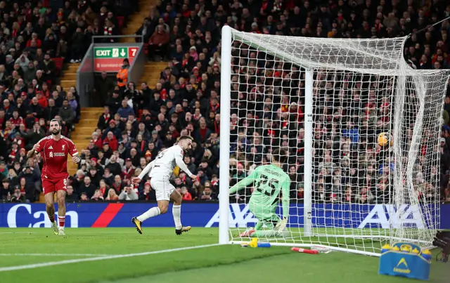 Adam Phillips scores against Liverpool after a mistake from Dominik Szoboszlai