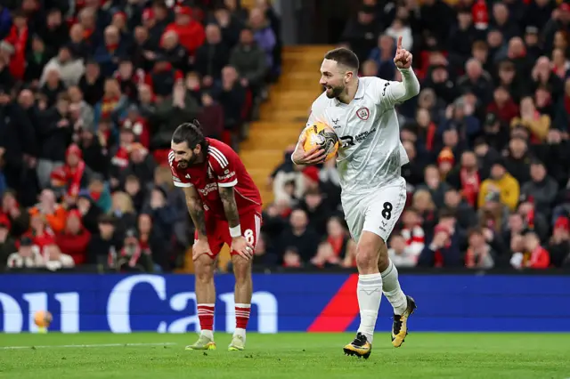 Adam Phillips celebrates after scoring against Liverpool
