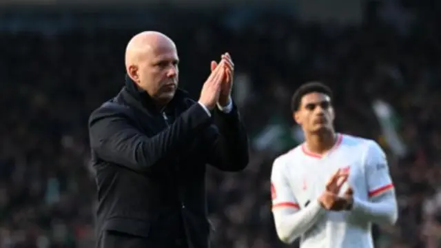 Arne Slot claps the Liverpool fans after their defeat to Plymouth