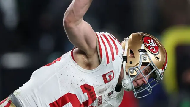 Christian McCaffrey spikes the ball after scoring a touchdown for the San Francisco 49ers against the Philadelphia Eagles