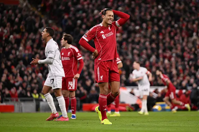 Virgil van Dijk reacts after his shot is saved by Murphy Cooper